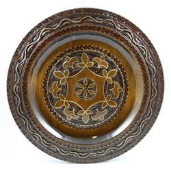 Polish wooden plates are made from Linden wood in the mountain region of southern Poland called Podhale.  The plates are cut and shaped on a lathe by hand.  The floral designs are burned into the wood then painted after staining and varnishing.