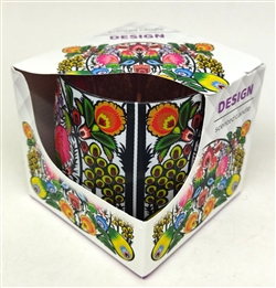 Very colorful and very traditional Polish paper cut motif graces this gorgeous glass candle holder.  The paraffin candle has a pleasant floral aroma.