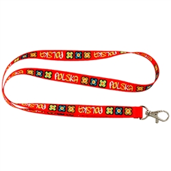 Red band imprinted with floral designs and the word Polska printed around.  Convenient metal lobster clip for hanging keys, ID, etc.