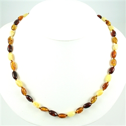 Lovely necklace composed of cherry, custard, light and dark honey Amber.
Oval Amber Bead size 3/8" long by 1/4" wide
Gold colored cord w/ knot between each bead
Silver claw clasp closure
