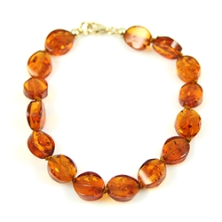 Nicely faceted amber stones on a knotted cord.