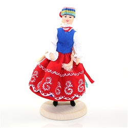 This traditional Polish doll is completely hand made the old fashioned way with papier mache, dress materials and paints.  The doll is clothed in authentic regional folk costume.