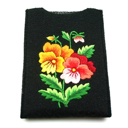 Soft black felt sewn case with Lowicz style embroidered flowers on one side. &#8203;