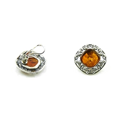 Attractive honey amber set in a filigree style sterling silver setting.