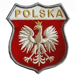 Embroidered white eagle on a red and white shield.