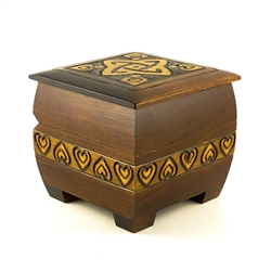 The stained locking chest is perfect to lock away any special treasure. The box is square in shape with rounded edges for a softer look. It has 4 square feet that raise the box by 3/8". The top is ornamented with brass inlay and sides with a burnt carving