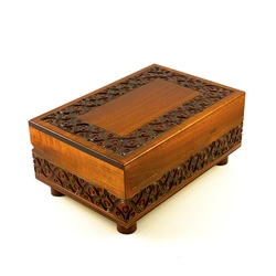 Looks like a beautifully finished and detailed wooden box from Poland (which it is), but there's more than meets the eye! This box won't open if you don't know the trick. Rotating feet unlock the box.  Interior has a red felt lined bottom.