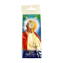 Pope John Paul II clear crystal bead rosary with Papal cross and center.  Enclosed in a clear pack with a picture card and prayer on the back. Made In Italy.