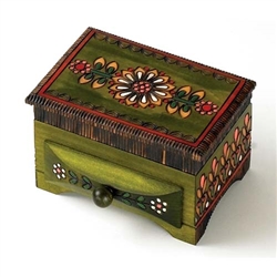 This box features a lidded compartment and a functioning drawer. Gorgeous floral motif carvings decorate the box, and the edges are etched and stained a deep brown. The piece is finished with green stain that gives the box an earthy and unique feel.