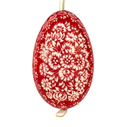 This beautifully designed goose egg is dyed one color and the design scratched into the egg using a sharp knife. The technique is called "skrobanki" in Polish. The eggs have been emptied and strung through with ribbon for hanging. No two eggs are exactly