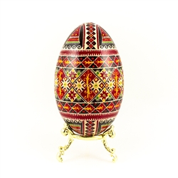 This beautifully designed and executed goose egg is hand painted by our artist from Canada using the traditional batik method. The egg has been emptied through two small holes at each end of the egg.