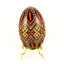 This beautifully designed and executed goose egg is hand painted by our artist from Canada using the traditional batik method. The egg has been emptied through two small holes at each end of the egg.