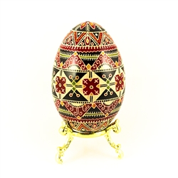 This beautifully designed and executed turkey egg is hand painted by our artist from Canada using the traditional batik method. The egg has been emptied through two small holes at each end of the egg. Stand sold separately.