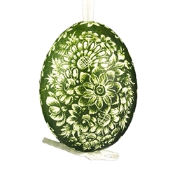 This beautifully designed chicken egg is dyed one color and the design scratched into the egg using a sharp knife. The technique is called "skrobanki" in Polish. The eggs have been emptied and strung through with ribbon for hanging. No two eggs are exactl