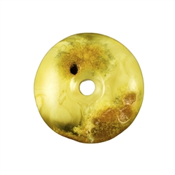 Very impressive polished doughnut shaped honey amber stone for pendant use. Weighs 7g. This amber stone is mainly polished but also has natural rough spots to highlight its natural origins. This stone also has two holes. A small one that occurred naturall