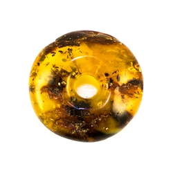 Very impressive polished doughnut shaped honey amber stone for pendant use. Weighs 11.2g. This amber stone is mainly polished but also has natural rough spots to highlight its natural origins.