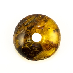 Very impressive polished doughnut shaped honey amber stone for pendant use. Weighs 12.2g. This amber stone is mainly polished but also has natural rough spots to highlight its natural origins.