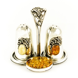 Very elegant sterling-silver salt and pepper set.  Consists of salt and pepper shakers and a holder. Only one available.