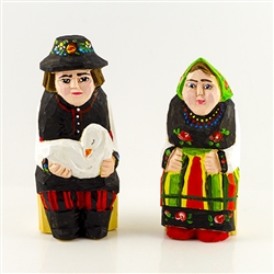 Hand carved and painted by folk artist Tadeusz Lesniak, our little couple is dressed in Lowicz costume from central Poland.