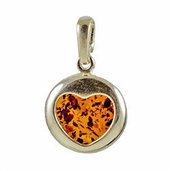 Hand made with Sterling Silver detail.  This is a round piece of amber in a heart outline frame.