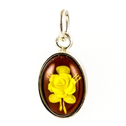 Beautiful oval honey amber carved Rose Cameo Pendant in a sterling silver frame. Size Approx .75 long x .4" wide.