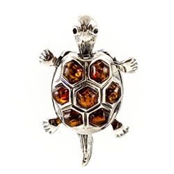 Hand made with Sterling Silver detail, our little turtle has a moveable head and tail.