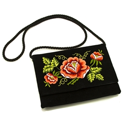 Hand embroidered clutch purse made from velvet. Fully lined. Extra long strap (extends to 22"). Snap closure. Made in Lowicz, Poland. Flower colors and design vary slightly from purse to purse.