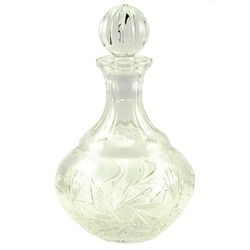 This is genuine Polish hand-cut leaded crystal decanter with matching crystal stopper.  Beautiful starburst cut is a classical pattern found in traditional Polish crystal.