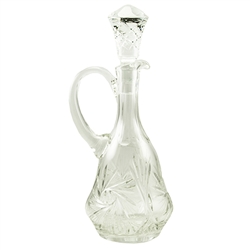 This is genuine Polish hand-cut leaded crystal decanter with matching crystal stopper.  Beautiful starburst cut is a classical pattern found in traditional Polish crystal.