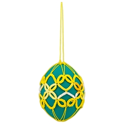 This beautiful tatted egg is dyed one color. . The egg is emptied and strung for hanging. Hand made In Poland.