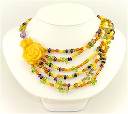 Bozena Przytocka is a designer of artistic amber jewelry based in Gdansk, Poland. Here is a beautiful example of her ability to blend amber, amethyst and peridot to create a stunning necklace.  Features two beautifully carved amber hearts.
