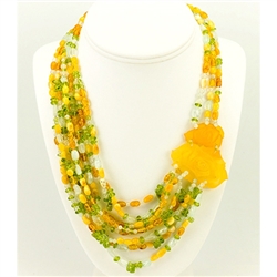 Bozena Przytocka is a designer of artistic amber jewelry based in Gdansk, Poland.   Here is a beautiful example of her ability to blend amber, aquamarine and peridot to create a stunning necklace.  Features two beautifully carved amber roses.