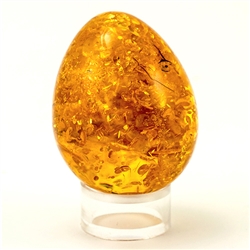 Exquisite egg shaped amber nugget.  Each year we look for one unique piece of amber for our store display.  This is our 2015 find.
Size approx 2"  x 1.5". Weighs 45.8 grams..