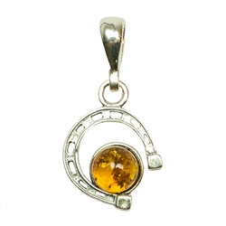 Charming amber pendant.  In Poland horseshoes are hung down so that luck will fall upon you.