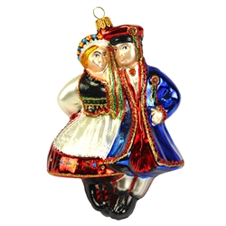 Add a lively vibe to your holiday celebrations with our unique Polish folk dancing couple ornament! Skillfully crafted of glass in Poland, this colorful depiction of traditional Krakowiak dancers is artfully hand-painted with bright glazes and sparkling g