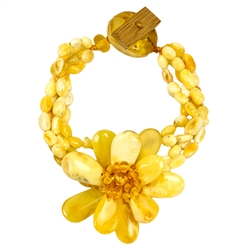 Bozena Przytocka is a designer of artistic amber jewelry based in Gdansk, Poland. Here is a beautiful example of her ability to blend different shades and shapes of amber to create a stunning bracelet. Center amber flower is 1.5" - 4cm in diameter.  4 st