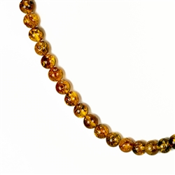Delicate round amber beads about 6mm in diameter. form this beautiful necklace.
