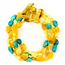 Bozena Przytocka is a designer of artistic amber jewelry based in Gdansk, Poland. Here is a beautiful example of her ability to blend amber and turquoise to create a stunning bracelet.
