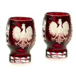 Genuine brilliant Polish 24% lead ruby red crystal hand cut with an engraved Polish Eagle and the word Polska on the front and a pinwheel design on the reverse.  Set of 2.