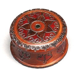 Handcarved and brass inlaid swirls create a flower-like pattern. Sides are carved as well.