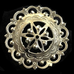 This Highlander pin is normally worn in the center of the man's shirt. Hand worked from metal with intricate detailing by one master artisan in Bukowina near Zakopane. The workmanship is exquisite and the detail so rich these decorations have become co