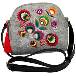 A small neat purse made of felt, which is characterized by high durability, as well as a robust leather strap with adjustable length. Despite the small size this handbag has a surprising capacity. The main decoration is a colorful embroidered Lowicz