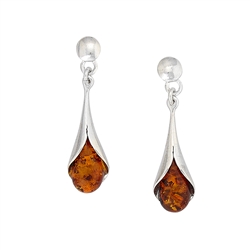 Drops of honey amber wrapped in silver in a calla lily shape.  Stylish and unique.