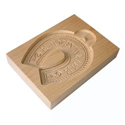 Solid beech wood hand carved mold featuring a traditional good luck (Na Szczescie) horseshoe folk design. This mold comes from the gingerbread museum in Torun, Poland. These types of wooden molds are used to create gingerbread and cookie designs.