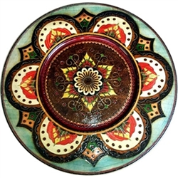 Hand Made in Southern Poland Polish wooden plates are made from Linden wood in the mountain region of southern Poland called Podhale. The plates are cut and shaped on a lathe by hand. The floral designs are burned into the wood then painted after staining