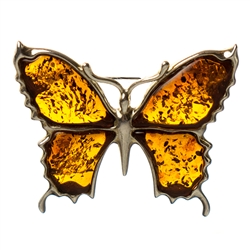 Beautiful hand made amber butterfly brooch with unique inclusions, set in sterling silver.  Size is approx 1" x 1.4".