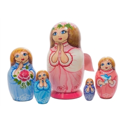 Your prayer has been answered...a fleet of five angels is coming your way in the form of a Russian nesting doll.  The largest has wooden 3-D wings attached, while the inner four have wings painted on their backs.  Each angel in this set looks heavenward