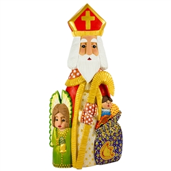 This St. Nicholas was carved and painted by Polish folk artist Andrzej Cichon from Kutno. Mr Cichon signs his work by carving a stylized version of his initials on the bottom of this carving. The body is carved from one block of wood (approx 16.25" x 7" x