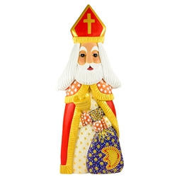 This St. Nicholas was carved and painted by Polish folk artist Andrzej Cichon from Kutno. Mr Cichon signs his work by carving a stylized version of his initials on the bottom of this carving. The body is carved from one block of wood (approx 16" x 6" x 2.