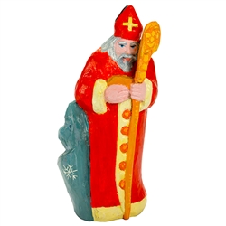 This St. Nicholas was carved and painted by Polish folk artist Leszek Pliniewicz.  Mr. Pliniewicz's works are quite interesting and in a "primitive" style.  Carved from one piece of wood.  The staff has a crack just above St. NIcholas's hand which is why